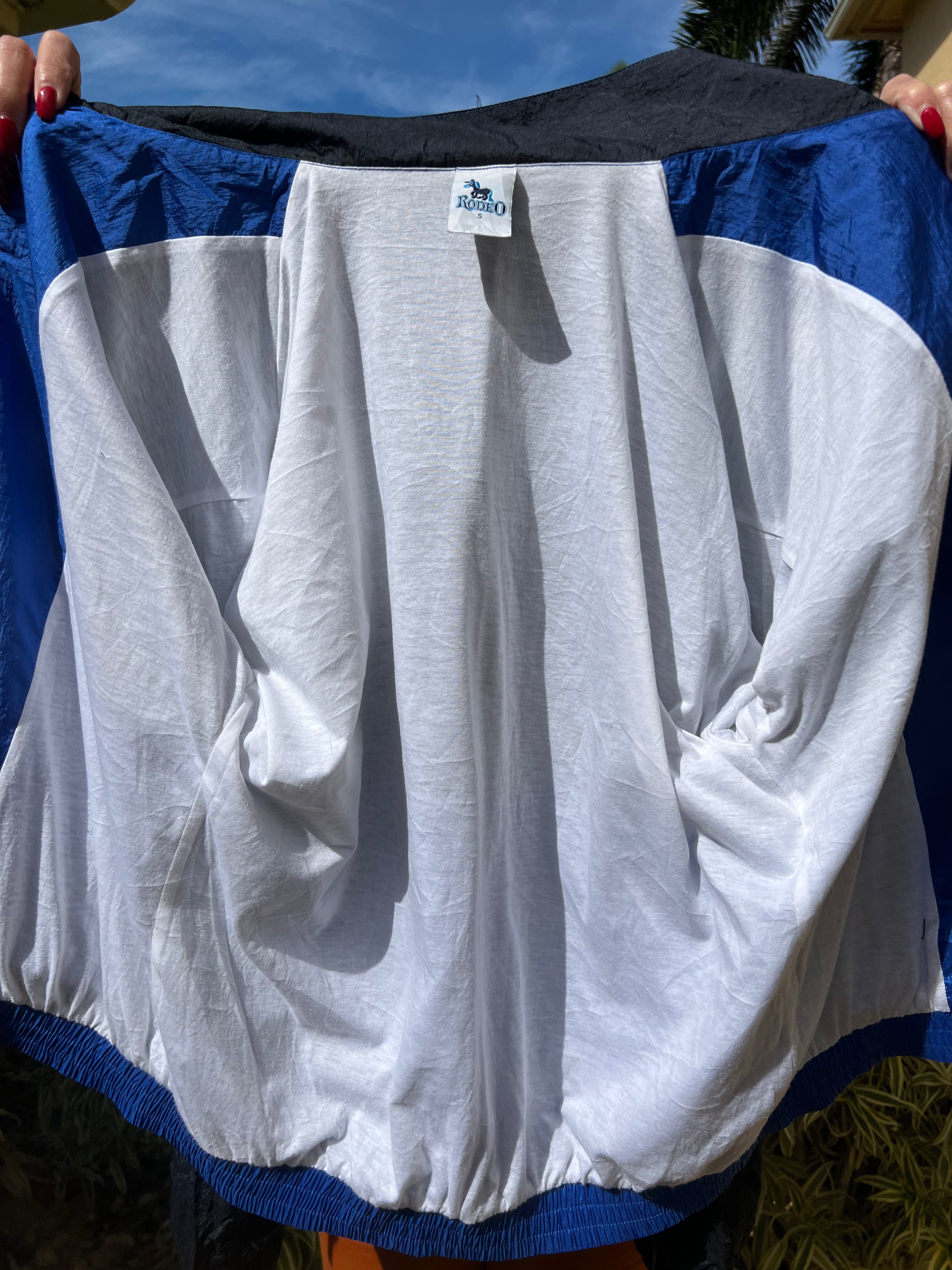 black and blue zip up trackie